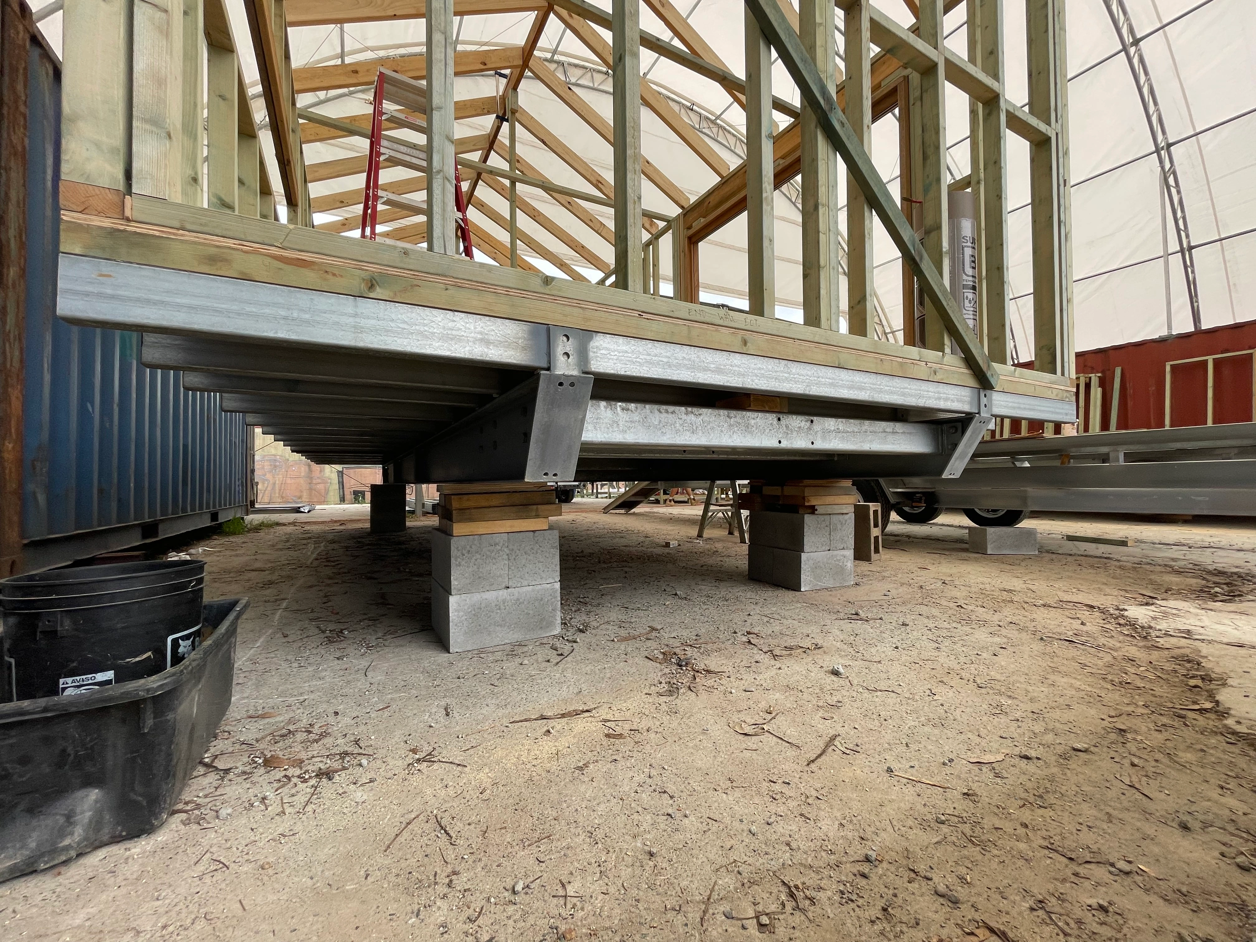 Timber cabin framing erected on a steel skid base