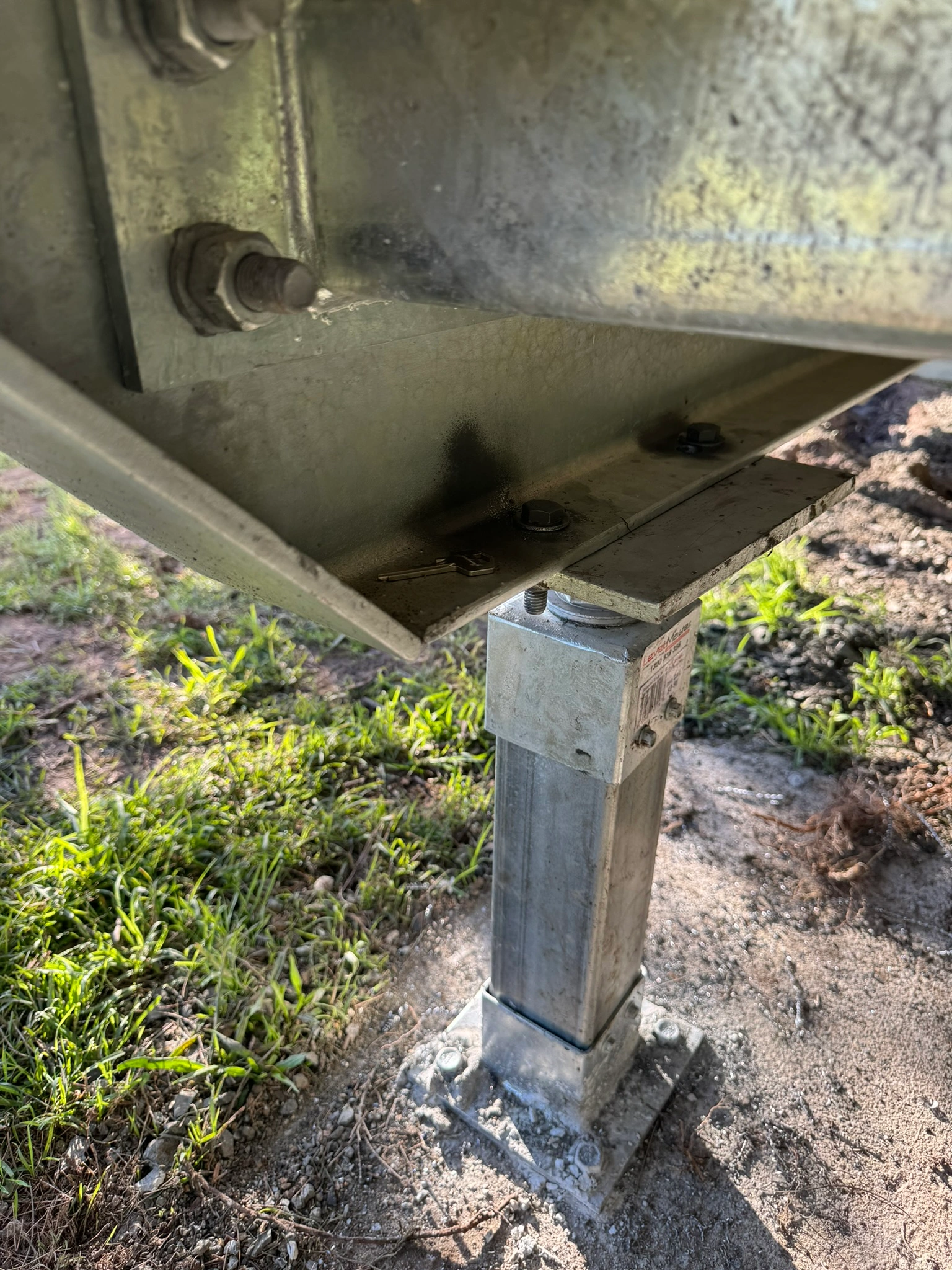 LevelMaster legs bolted to underside of Zinc Studio Cabin and into concrete footings.